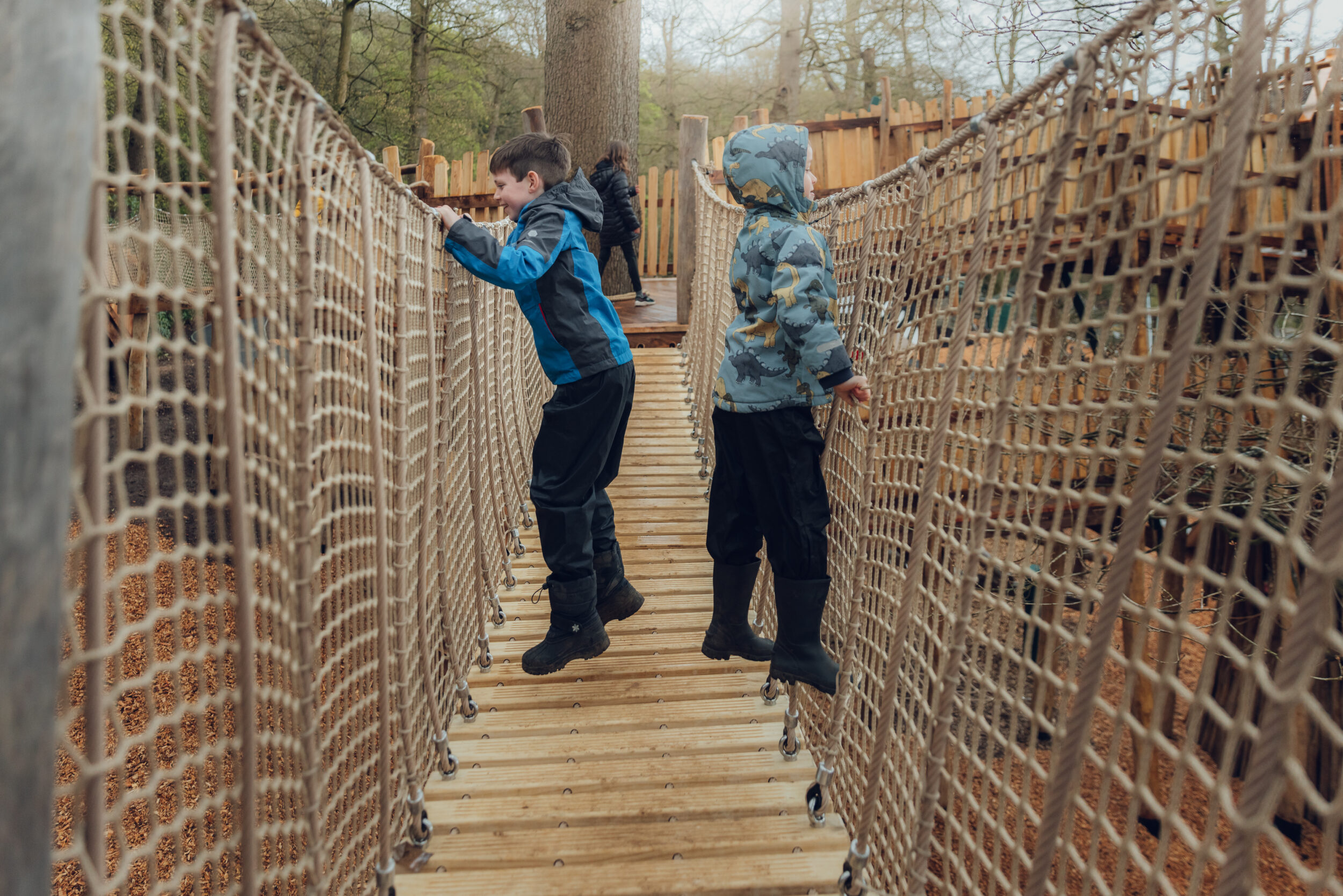 Family walking on a scenic Peak District trail with children